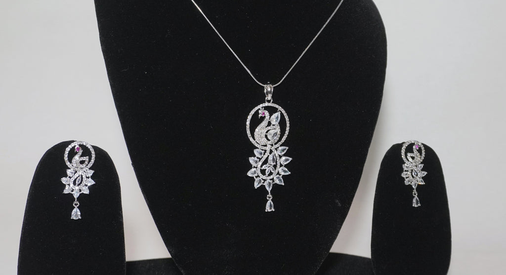 Elegant Silver-Toned Peacock Motif Pendant and Earring Set with Shimmering Stone Accents