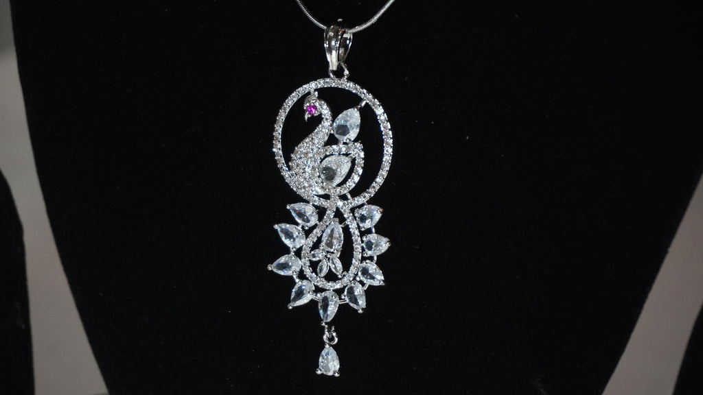 Elegant Silver-Toned Peacock Motif Pendant and Earring Set with Shimmering Stone Accents