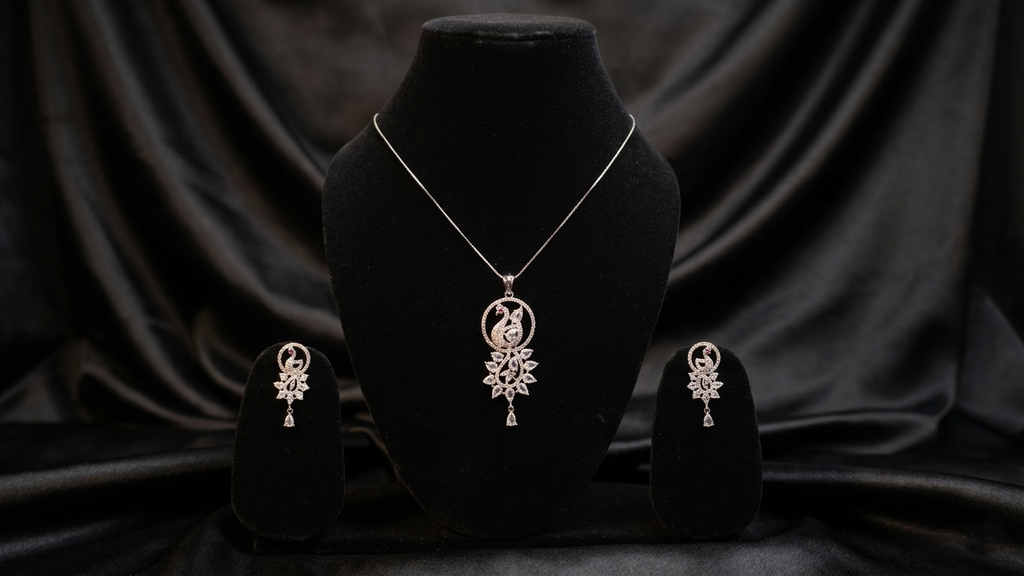 Elegant Silver-Toned Peacock Motif Pendant and Earring Set with Shimmering Stone Accents